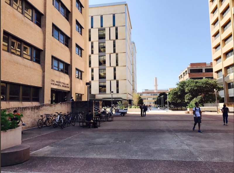 breezeway in front of ECJ building with people walking