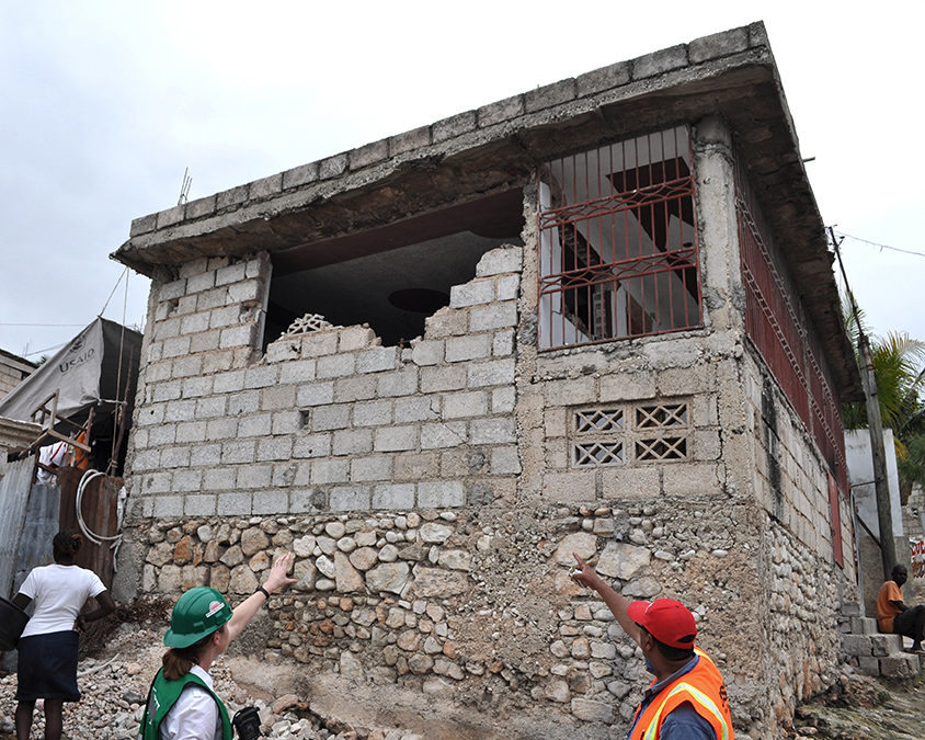 brick building with construction workers