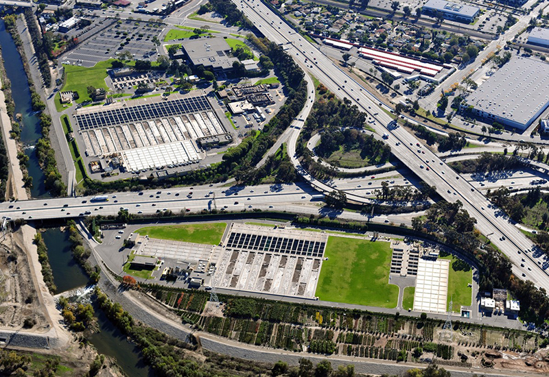 aerial view of highways next to river channel