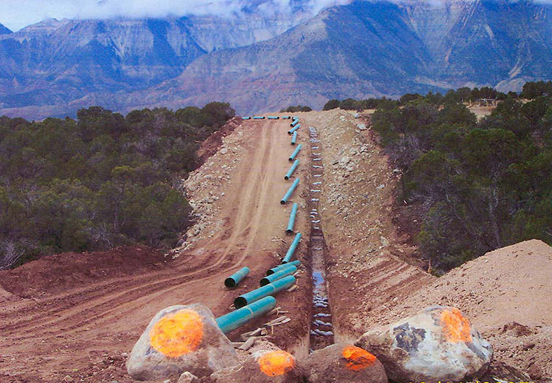 dirt road with pipes