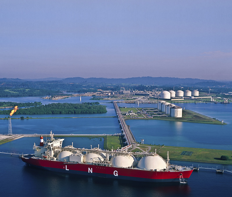 gas tanker in harbor at dusk