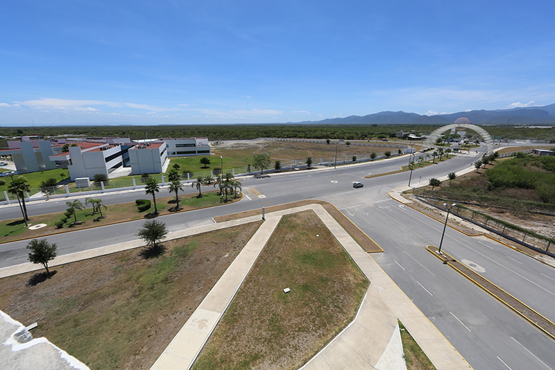 aerial view of streets in a green landscape