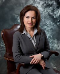 Texas CAEE alumna Patricia Metcalf sitting in chair