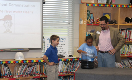 Kolenovsky demonstration in elementary school library with kids