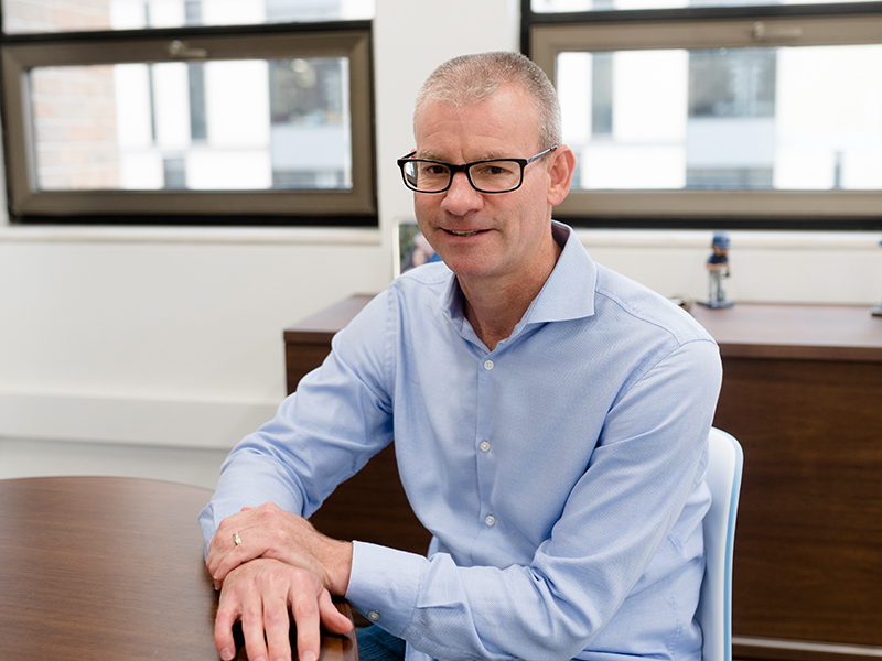 Bob Gilbert sitting at desk