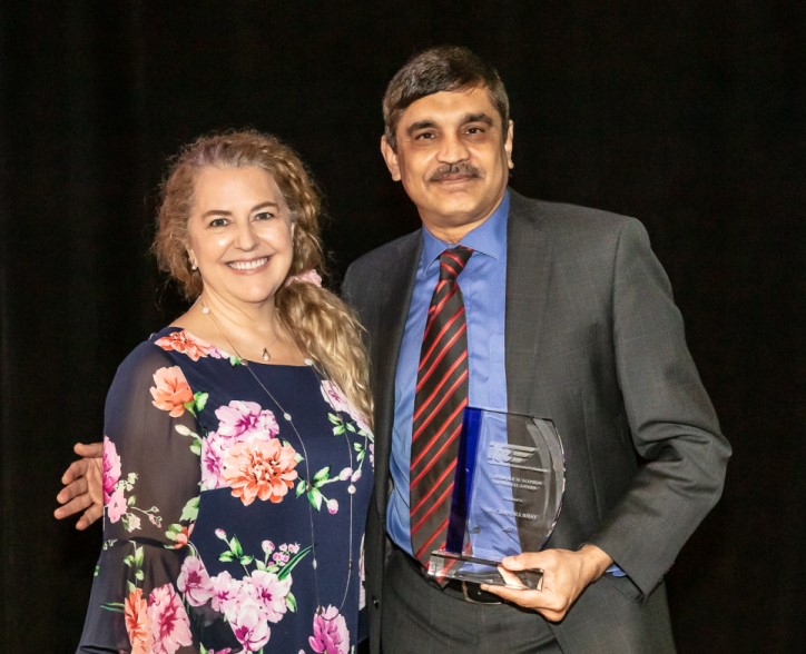 Chandra Bhat standing with Beverly Kuhn, the 2022 International President of the Institute of Transportation Engineers (ITE) 